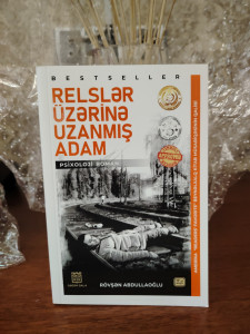 Kitab, Rövşən Abdullaoğlu-Relslər üzərinə uzanmış adam